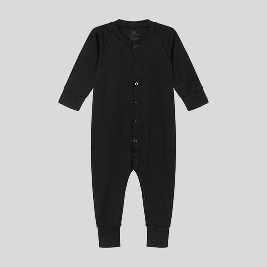 Baby sleepsuit in black, with black snaps and a front opening (third snap in white)
